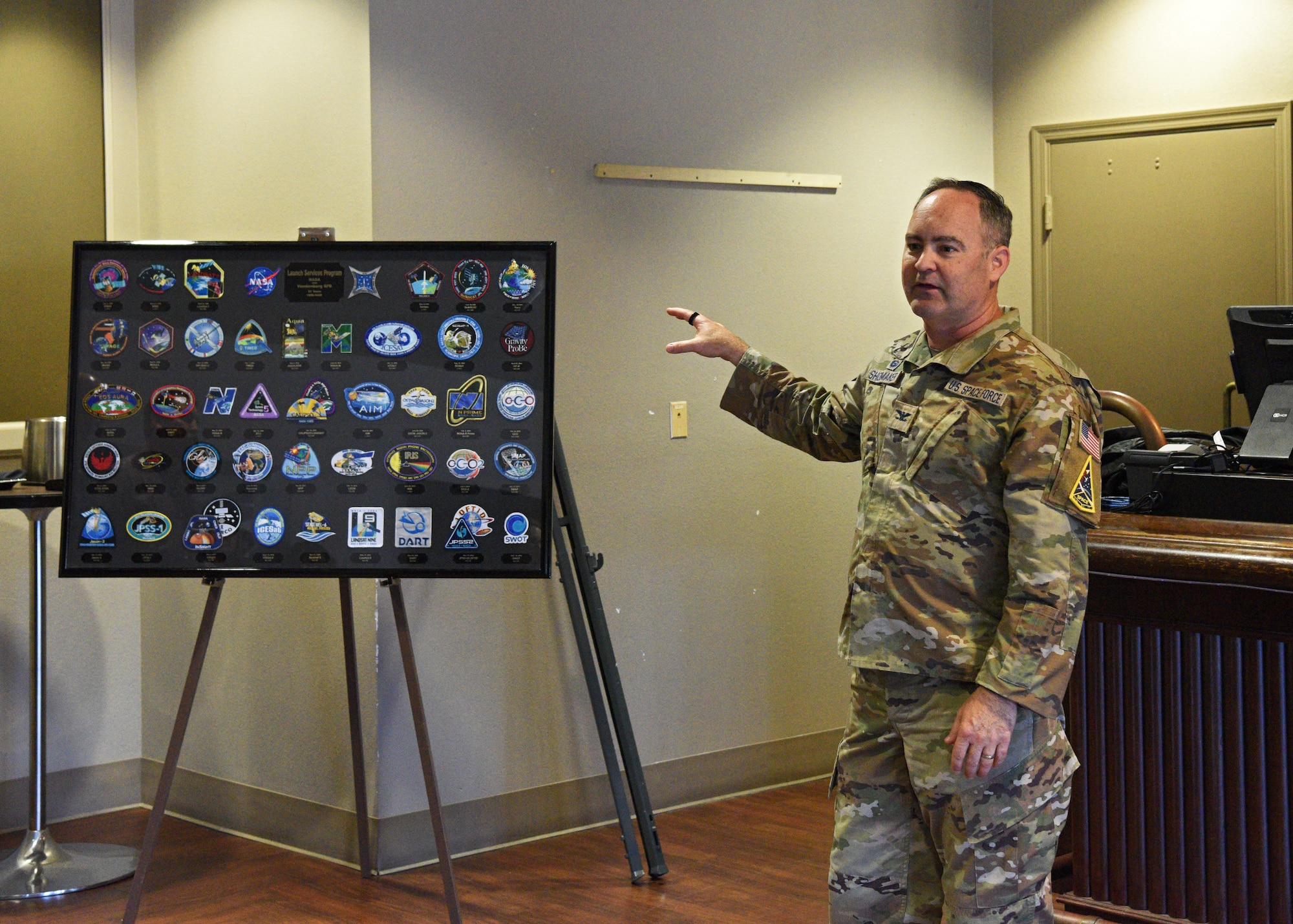 U.S. Space Force Col. Mark Shoemaker, Space Launch Delta 30 commander, addresses Team Vandenberg personnel during a patching ceremony celebrating Vandenberg’s 27-year partnership with NASA, at Vandenberg Space Force Base, Calif., June 26, 2025. NASA donated 42 mission patches to recognize each of their critical launch operations that occurred at Vandenberg.