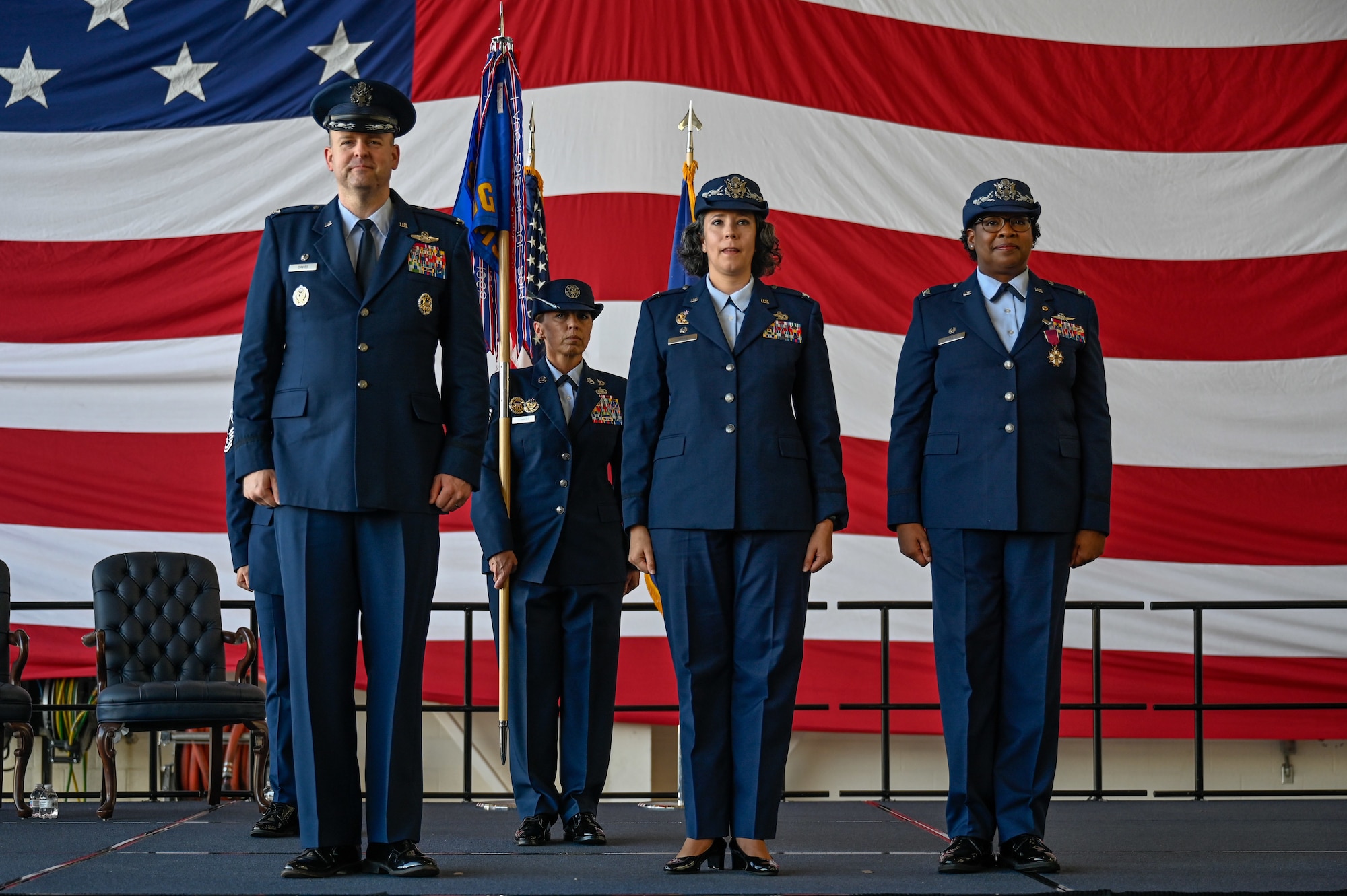 (From left to right) U.S. Air Force Col. Denny Davies, 19th Airlift Wing commander, Col. Katrina Smith, 19th Mission Support Group incoming commander, and Col. N’Keiba Estelle, 19th MSG outgoing commander, stand at attention during the 19th MSG Change of Command Ceremony, June 27, 2025, at Little Rock Air Force Base, Arkansas.