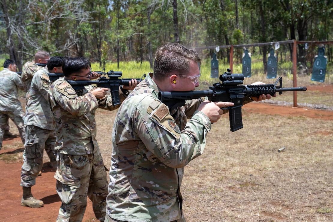U.S. Air Force Airmen fire their M4 carbine rifles at practice targets during combat arms training and maintenance.