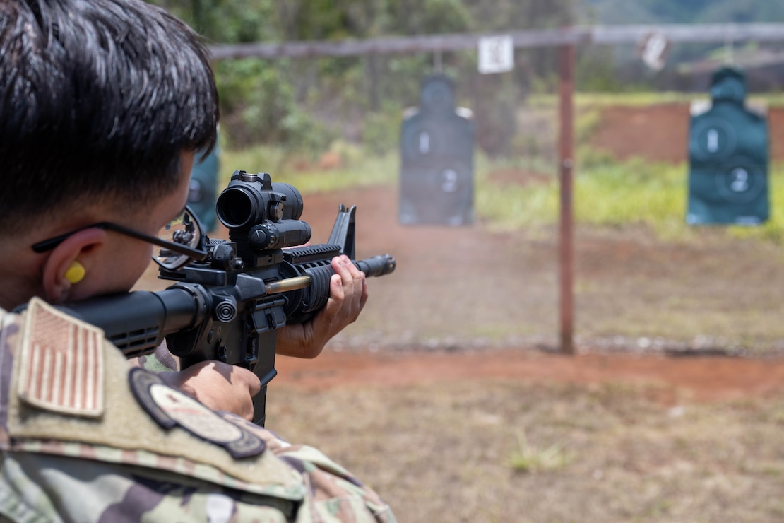 A U.S. Air Force Airmen fires his M4 carbine weapon at practice targets during combat arms training and maintenance.