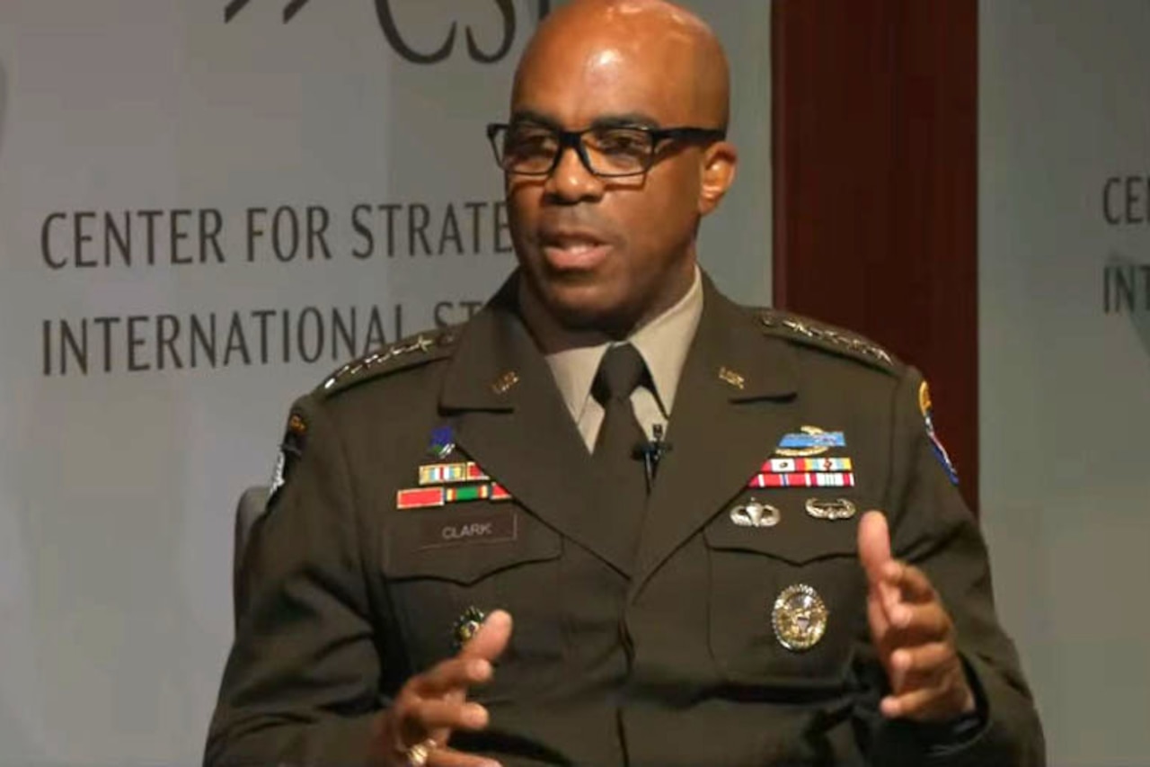A general wearing an Army dress uniform speaks during a seated interview at a Washington think tank.
