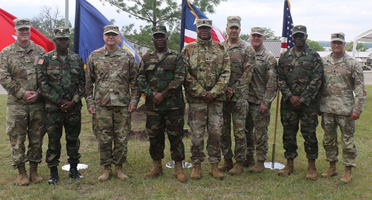 Michigan Army National Guard, stand for a photo in front of a white pine – Michigan’s state tree – dedicated near the Camp Grayling chapel to symbolize the strength of the Michigan-Liberia partnership