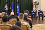 Lt. Gen. Thomas Hensley, 16th Air Force (Air Forces Cyber) commander, emphasizes the importance of change of responsibility for senior enlisted leaders, at JBSA-Lackland, Texas, June 13, 2025. Chief Master Sgt. Robert Hopkins, 16 AF outbound command chief and Chief Master Sgt. Andrew McKendree, 16 AF inbound command chief, participate in the unit’s first dual change of responsibility ceremony. (U.S. Air Force photo by Matthew McGovern)