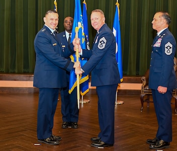 16th AF Commander hands flag to new command chief.
