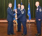 67th Commander hands flag to new Command Chief.