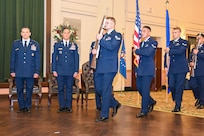 Honor Guard walks on stage with colors.