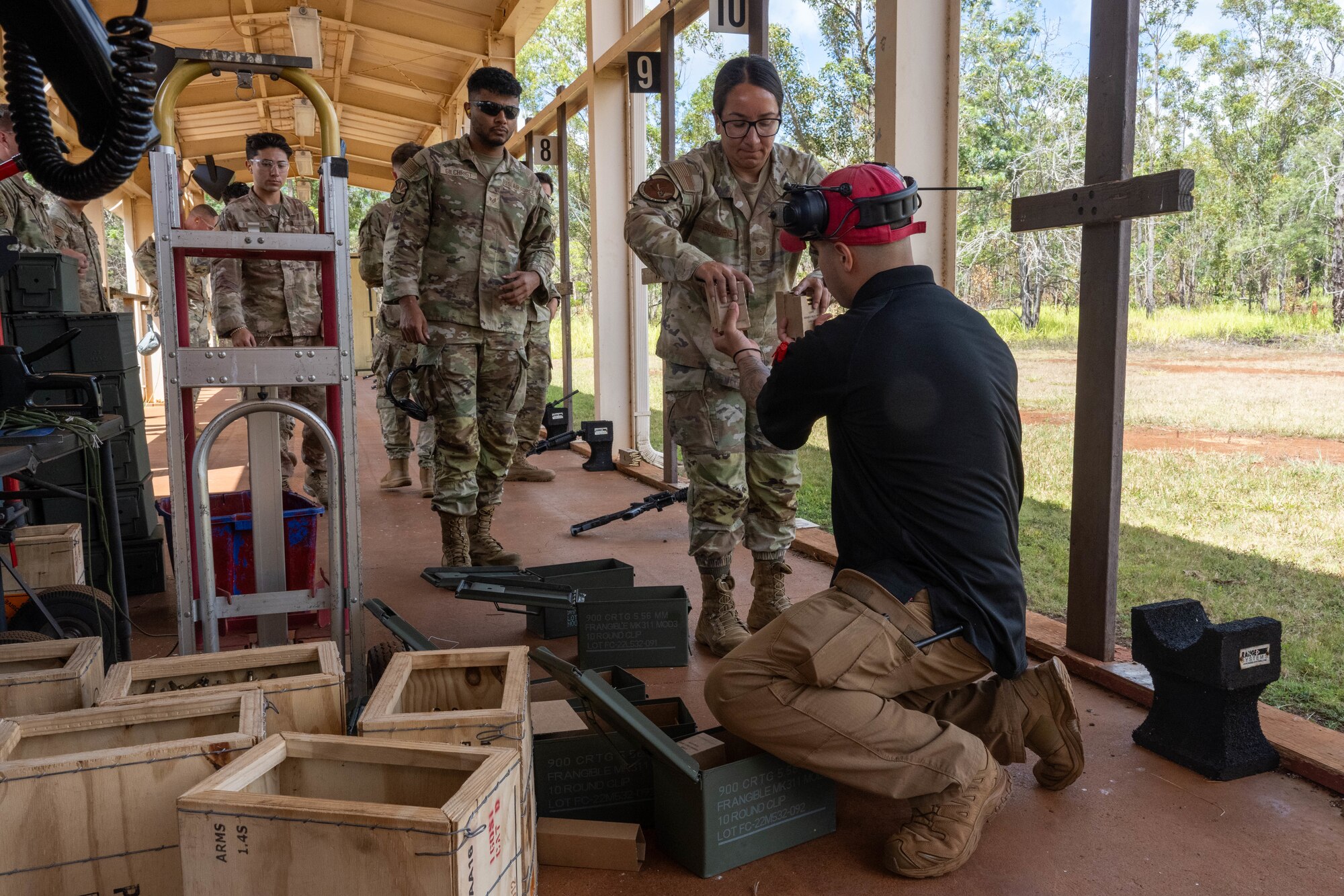 U.S. Air Force Airmen receive ammunition for the M4 carbine rifle during combat arms training and maintenance.