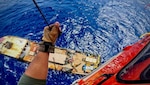A Coast Guard Air Station Miami aircrew medically evacuates a man from a 100-foot supply vessel approximately 70 nautical miles southeast of Key West, June 28, 2025. The man reportedly sustained an arm injury while aboard the vessel and was transported to Jackson Memorial Hospital for a higher level of care. (U.S. Coast Guard photo by Air Station Miami)