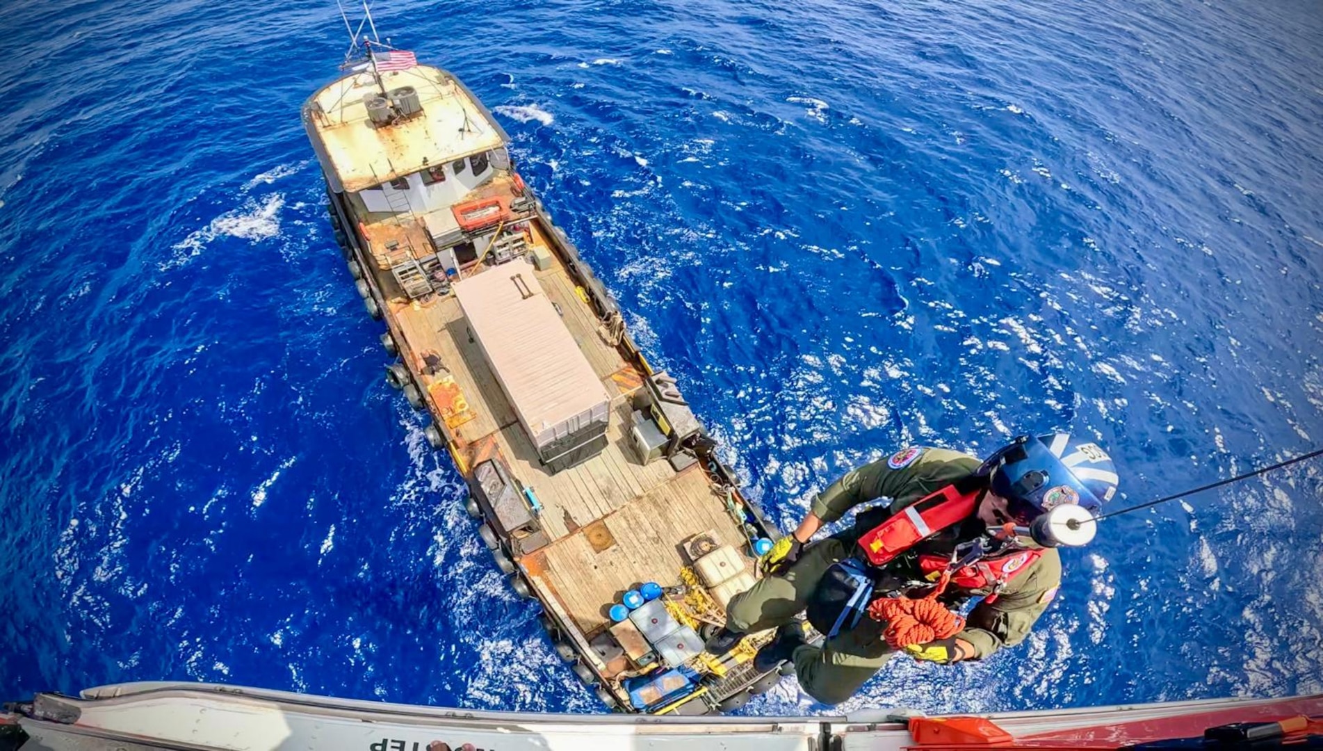 A Coast Guard Air Station Miami aircrew medically evacuates a man from a 100-foot supply vessel approximately 70 nautical miles southeast of Key West, June 28, 2025. The man reportedly sustained an arm injury while aboard the vessel and was transported to Jackson Memorial Hospital for a higher level of care. (U.S. Coast Guard photo by Air Station Miami)