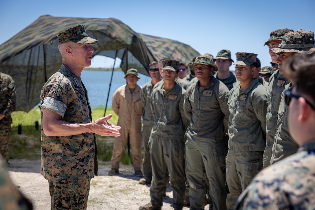 The 39th Commandant of the Marine Corps, Gen. Eric Smith, speaks with Marines with 2nd Amphibious Assault Battalion at Mile Hammock Bay, North Carolina, May 22, 2025. Gen. Smith visited to receive updates on training, modernization efforts and to recognize several Marines for their performance and accomplishments. (U.S. Marine Corps photo by Lance Cpl. Joshua Bustamante)