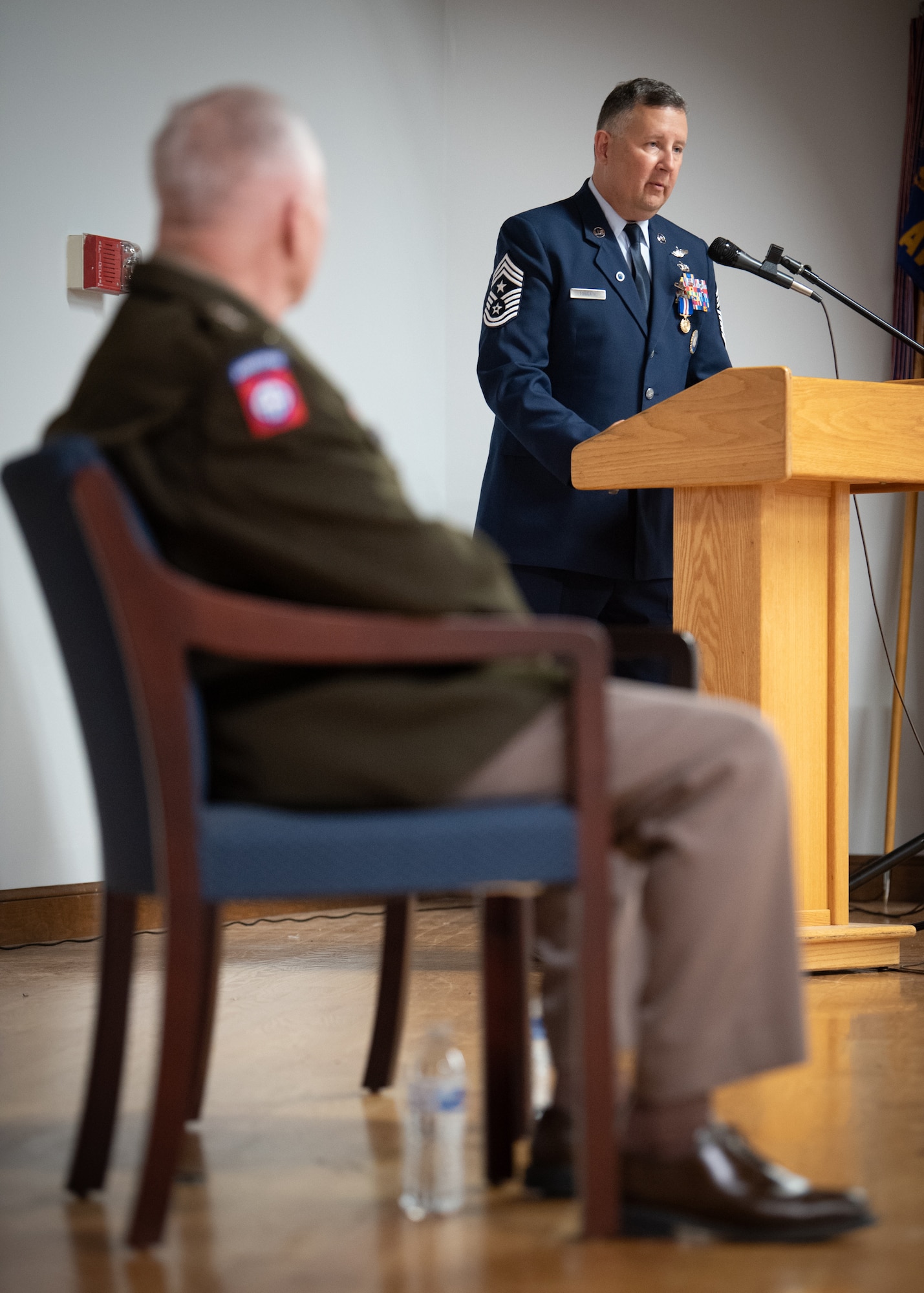 Chief Master Sgt. James Tongate, Kentucky Air National Guard state command chief, speaks during his retirement ceremony at the Kentucky Air National Guard Base in Louisville, Ky., April 13, 2025. Tongate served the U.S. military for 33 years. (U.S. Air National Guard photo by Master Sgt. Joshua Horton)