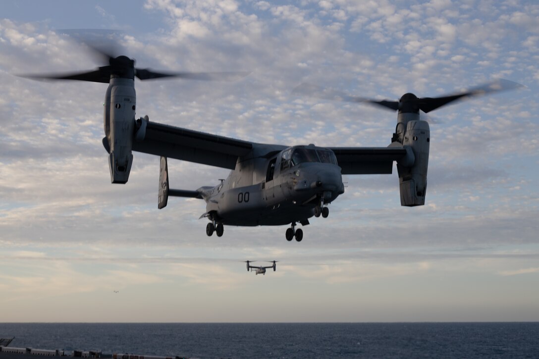 U.S. Marines Corps MV-22B Ospreys assigned to Marine Medium Tiltrotor Squadron (VMM) 265 (Rein.), 31st Marine Expeditionary Unit, descend to land during flight operations aboard the amphibious assault ship USS America (LHA 6), in the Coral Sea, June 26, 2025.