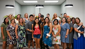 U.S. Air Force Ret. Col. Melchizedek “Kato” Martinez speaks to members of Team Andersen Spouses’ Club at Andersen Air Force Base, Guam, June 26, 2025. The gathering was to honor the memory of a former member of TASC, Gail Minglana Martinez. (U.S. Air Force photo by Senior Airman Audree Campbell)