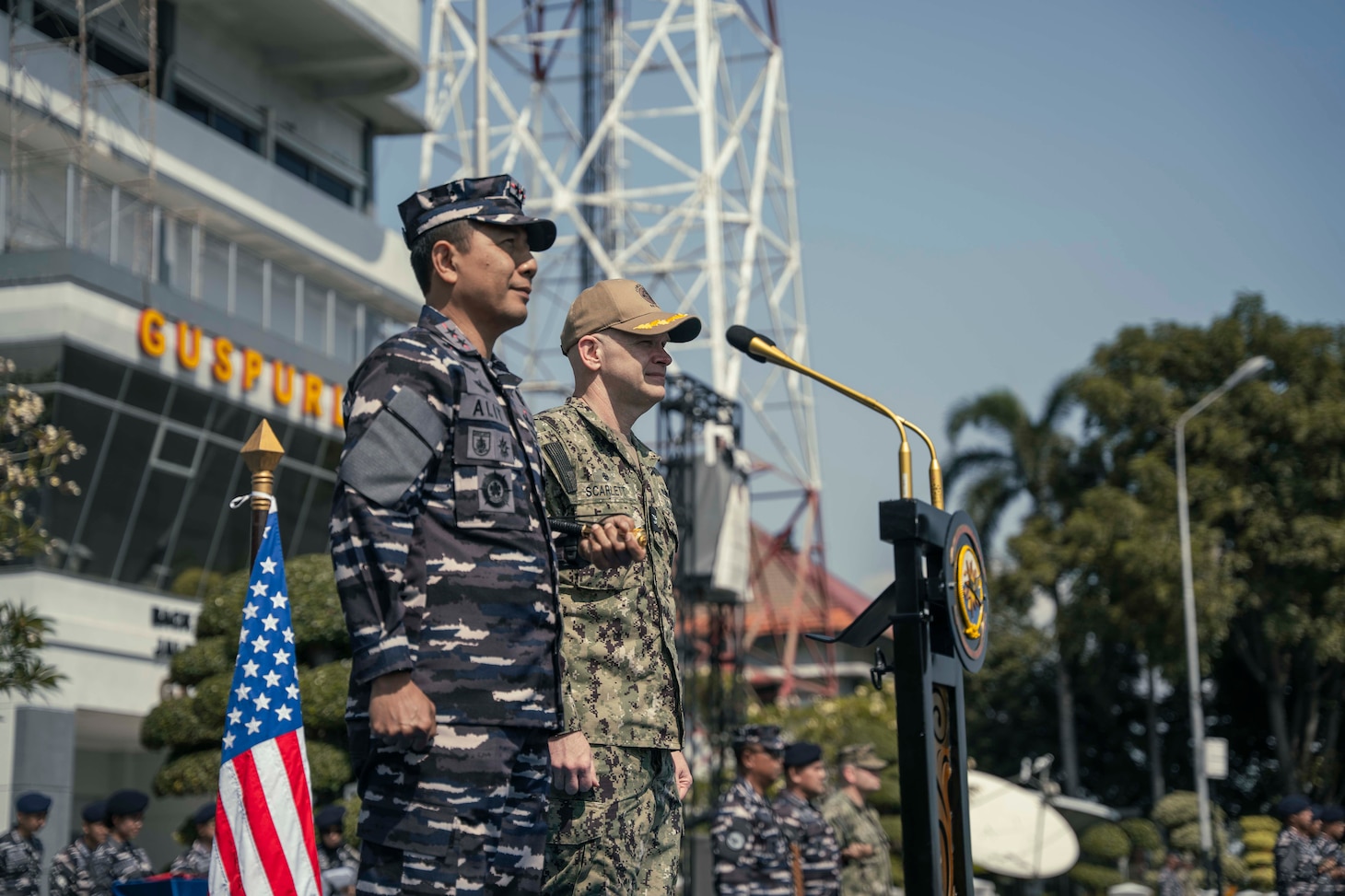 250623-N-CM740-1258 SURABAYA, Indonesia (June 23, 2025) - U.S. Navy Capt. Matt Scarlett, commodore, Destroyer Squadron Seven, right, and Rear Adm. I Gung Putu Alit Jaya, commander in chief, 2nd Fleet, Indonesian Navy, participate in the opening ceremony of Cooperation Afloat Readiness and Training (CARAT) Indonesia 2025 at Tentara Nasional Indonesia Angkatan Laut (TNI-AL) headquarters in Surabaya, Indonesia, June 23, 2025. CARAT Indonesia is a bilateral exercise between Indonesia and the United States designed to promote regional security cooperation, maintain and strengthen maritime partnerships, and enhance U.S. and partner navies’ abilities to operate together in response to maritime security challenges in the Indo-Pacific region (U.S. Navy photo by Mass Communication Specialist 1st Class Robert Stamer)