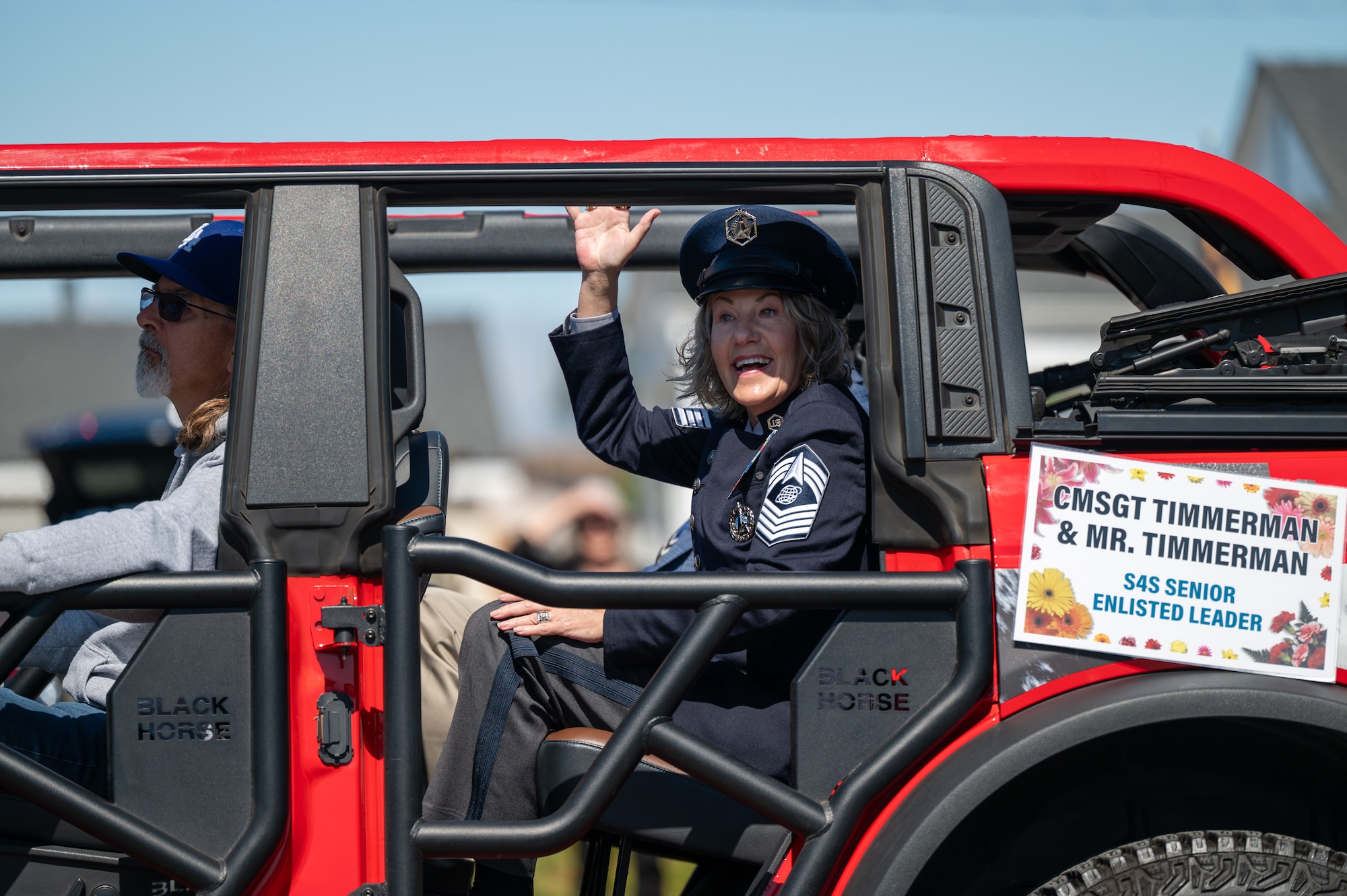 U.S. Space Force Chief Master Sgt., U.S. Space Forces-Space senior enlisted leader, waves to the crowd at the Lompoc Flower Festival parade in Lompoc, Calif., June 28, 2025. Leadership from U.S. Space Forces - Space and Space Launch Delta 30 participated in the parade which had over 50 entrees and 500 attendees.