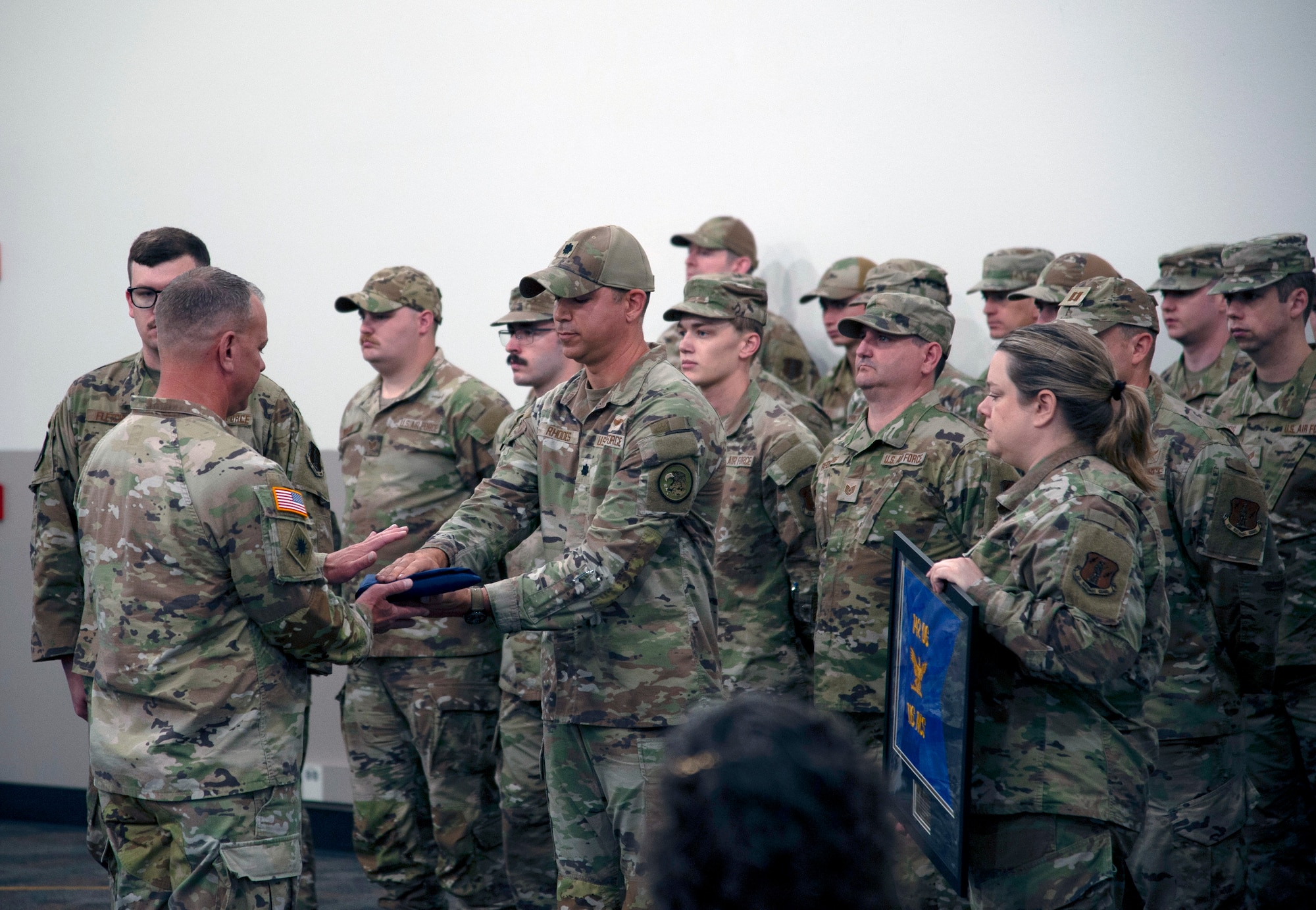 Lt. Col. Nicholas Rhodes returns the Oregon State Flag to the Adjutant General during a demobilization ceremony in Warrenton, Oregon on 8 June, 2025. That flag was brought with members of the 116th Air Control Squadron that deployed in the fall of 2024 in support of United States Central Command.