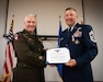 Chief Master Sgt. James Tongate, right, Kentucky Air National Guard state command chief, is presented with the Kentucky Distinguished Service Medal by U.S. Army Maj. Gen. Haldane Lamberton, Kentucky’s adjutant general, during Tongate’s retirement ceremony at the Kentucky Air National Guard Base in Louisville, Ky., April 13, 2025. Tongate served the U.S. military for 33 years. (U.S. Air National Guard photo by Master Sgt. Joshua Horton)
