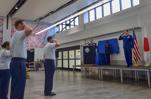 U.S. Air Force Col. Cataleya Carlson, 515th Air Mobility Operations Group incoming commander, renders a first salute.