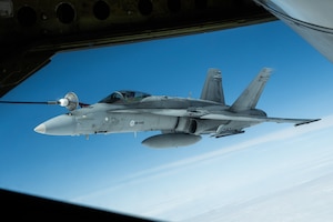 A Finnish Air Force F/A-18 Hornet receives fuel from a U.S. Air Force KC-135 Stratotanker from the 100th Air Refueling Wing, RAF Mildenhall, England, for fuel during exercise Atlantic Trident 25 over Finland, June 24, 2025.