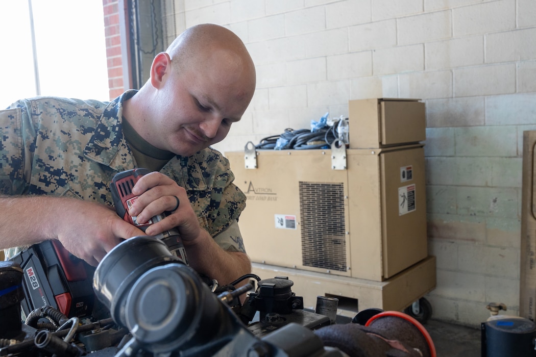 U.S. Marine Corps Cpl. Jack Wonsmos, a basic utilities systems technician with Combat Logistics Company 21, 2nd Combat Readiness Regiment, 2nd Marine Logistics Group, poses for a photo at Marine Corps Air Station Cherry Point, North Carolina, June 26, 2025. Wonsmos’s command selected him as warrior of the week for serving in the demanding billet as the quality control non-commissioned officer, a billet routinely held by a sergeant which involves, directing, supervising, inspecting and teaching Marines of all ranks intermediate level repairs on all engineer equipment platforms. Each week, 2nd MLG recognizes one outstanding Marine or Sailor that goes above and beyond in their duties and embodies the qualities of an outstanding service member. (U.S. Marine Corps photo by Cpl. Apollo Wilson)