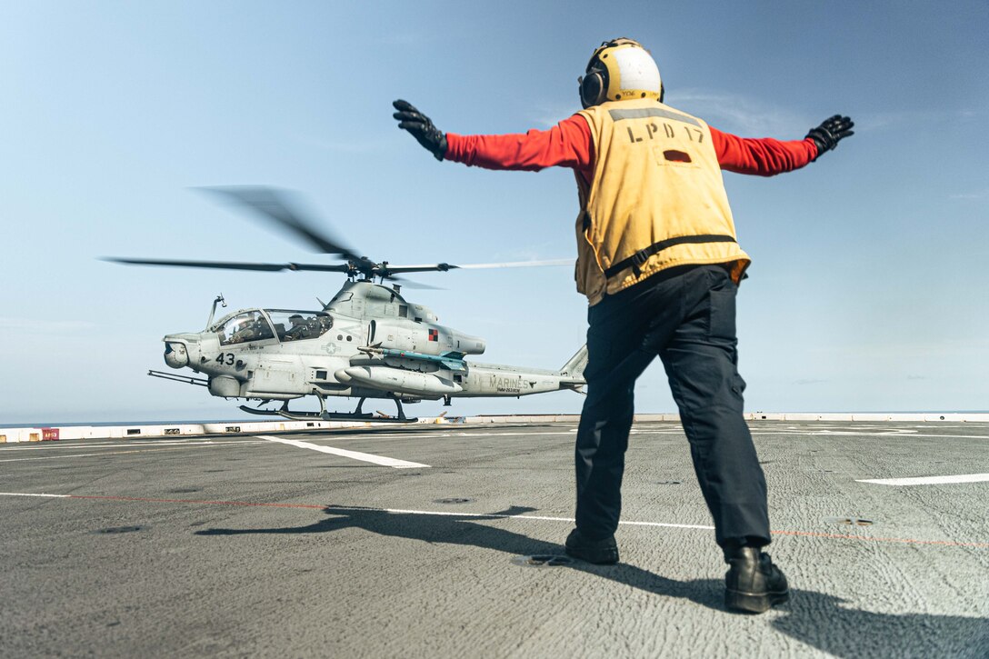 A U.S. Marine Corps AH-1Z Cobra with Marine Medium Tiltrotor Squadron 263 (Reinforced), 22nd Marine Expeditionary Unit (Special Operations Capable), lands during Composite Training Unit Exercise aboard the San Antonio-class amphibious transport dock ship USS San Antonio (LPD 17), Iwo Jima Amphibious Ready Group, while underway in the Atlantic Ocean, June 26, 2025. During COMPTUEX, the IWOARG and 22nd MEU (SOC), refine tactics, techniques, and procedures to execute warfighting functions that enhance operational readiness and lethality as a unified IWOARG/22 MEU (SOC) team. (U.S. Marine Corps photo by Cpl. Maurion Moore)
