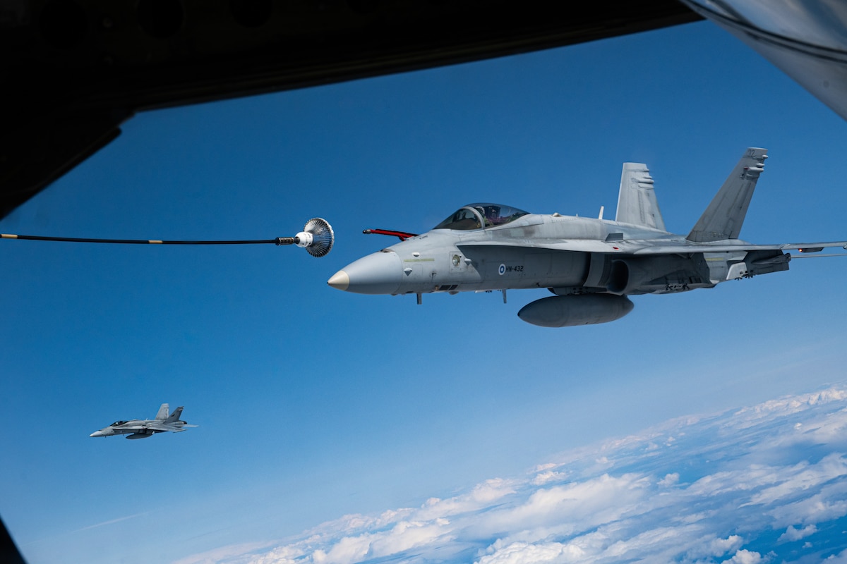 A Finnish Air Force F/A-18 Hornet approaches a U.S. Air Force KC-135 Stratotanker from the 100th Air Refueling Wing, RAF Mildenhall, England, for fuel during exercise Atlantic Trident 25 over Finland, June 26, 2025.