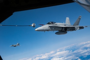 A Finnish Air Force F/A-18 Hornet approaches a U.S. Air Force KC-135 Stratotanker from the 100th Air Refueling Wing, RAF Mildenhall, England, for fuel during exercise Atlantic Trident 25 over Finland, June 26, 2025.