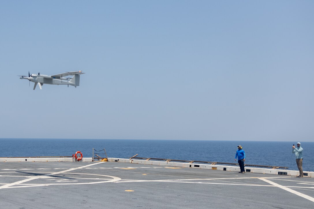 A Jump 20 group 3 Unmanned Aerial System conducts a surveillance flight during Composite Training Unit Exercise aboard the San Antonio-class amphibious transport dock ship USS San Antonio (LPD 17), Iwo Jima Amphibious Ready Group, while underway in the Atlantic Ocean, June 25, 2025. During COMPTUEX, the IWOARG and 22nd Marine Expeditionary Unit (Special Operations Capable) refine tactics, techniques, and procedures to execute warfighting functions that enhance operational readiness and lethality as a unified IWOARG/22 MEU (SOC) team. (U.S. Marine Corps photo by Lance Cpl. Kyle Baskin)