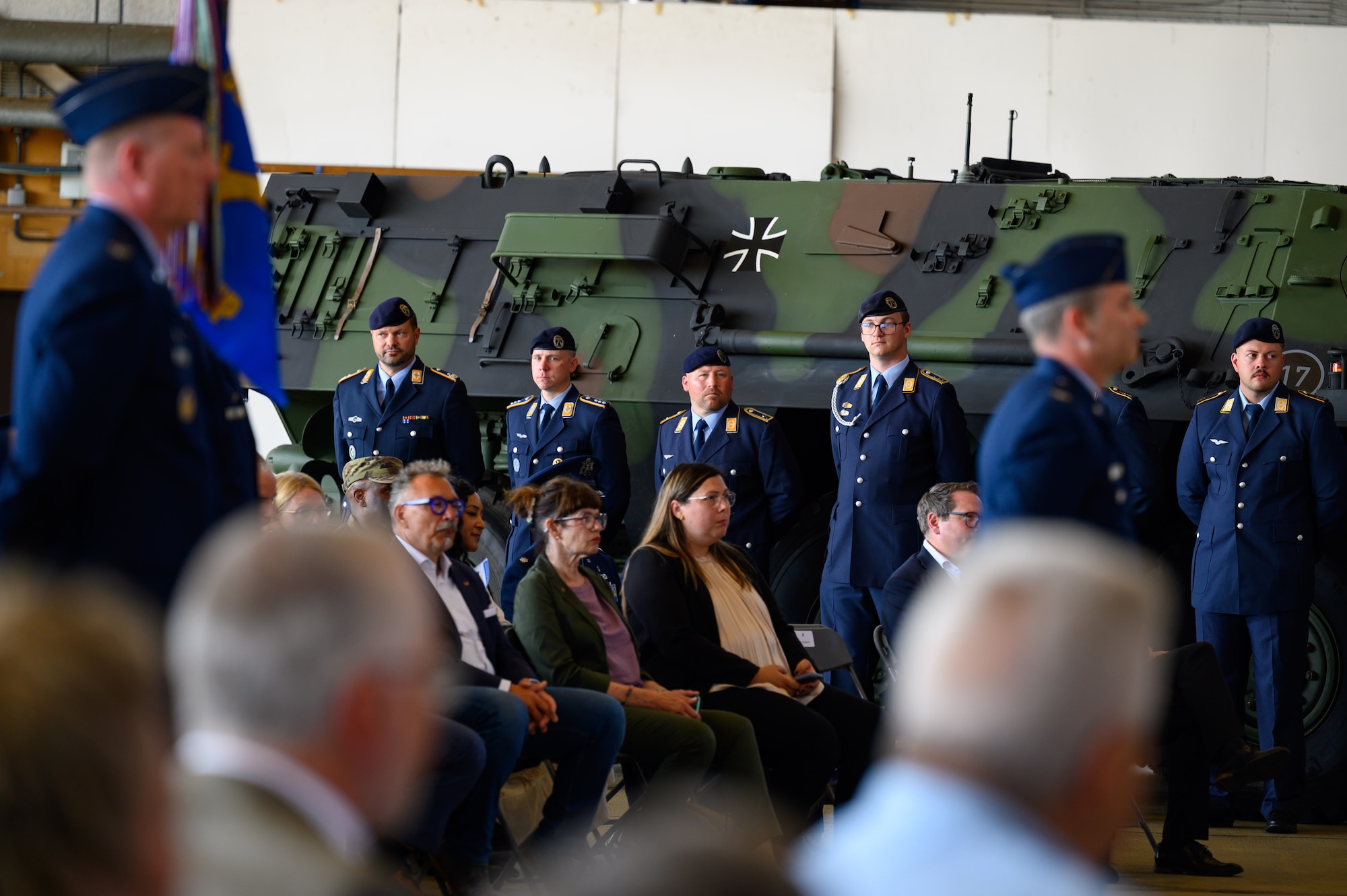 U.S. Air Force, German Bundeswehr service members and local leaders attend a change of command ceremony.