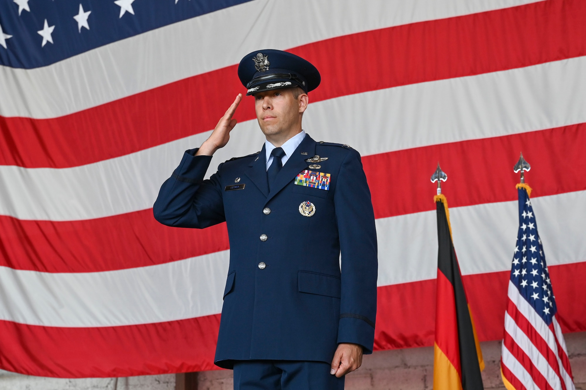 An incoming commander renders a first salute during his change of command ceremony.
