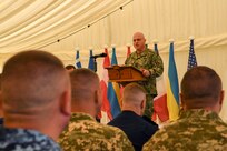 Rear Admiral Michael Mattis, director, strategic effects, U.S. Naval Forces Europe/Africa, commander, Task Force - SIX SIX (66) gives a speech during the opening ceremony of Sea Breeze 2025-2, June 30, 2025. Sea Breeze is an annual maritime exercise aimed at building collective capability and agility to restore security and stability in the dynamic Black Sea. Sea Breeze 2025-2 is focused on mine countermeasure, explosive ordinance disposal, dive operations, and unmanned underwater vehicles.