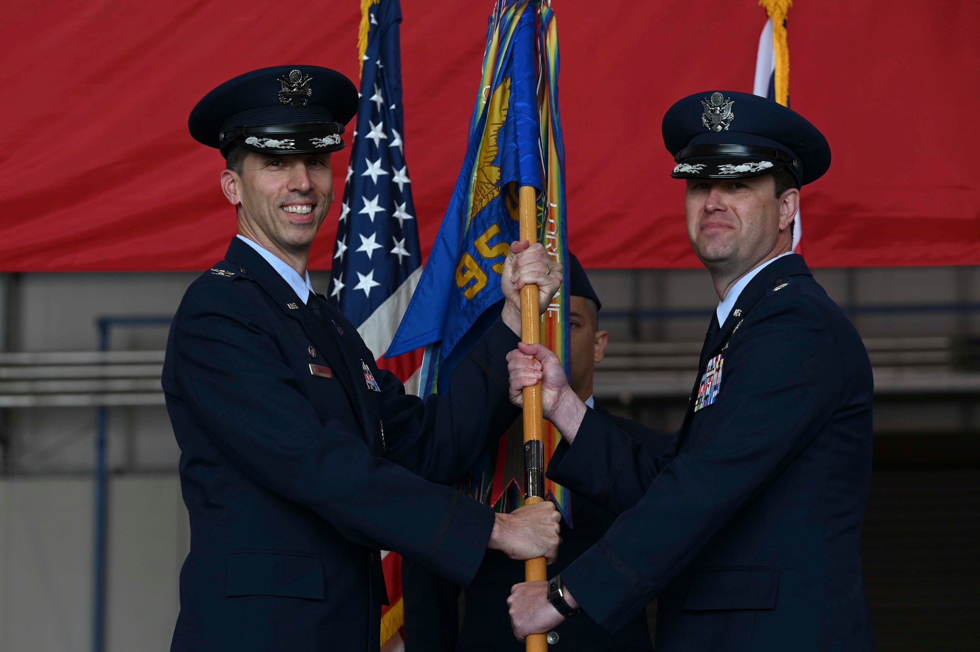 The ceremony presents a visible transfer of authority from the departing commander to the new commander.