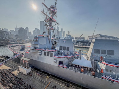 NEW YORK CITY, New York – The crew of the Navy’s newest Arleigh Burke-class guided-missile destroyer, USS John Basilone (DDG 122), “manned the ship and brought her to life” during a commissioning ceremony held in New York, Nov. 9, 2024. Bob Nees, the engineering manager for Surface Warfare Systems for Electromagnetic Environmental Effects Technical Warrant Holder at Naval Surface Warfare Center Dahlgren Division, helped develop a solution to address an electromagnetic interference issue before the Navy could accept the Basilone. (Mass Communication Specialist 2nd Class Theoplis Stewart II/U.S. Navy photo)