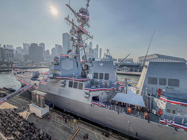 NEW YORK CITY, New York – The crew of the Navy’s newest Arleigh Burke-class guided-missile destroyer, USS John Basilone (DDG 122), “manned the ship and brought her to life” during a commissioning ceremony held in New York, Nov. 9, 2024. Bob Nees, the engineering manager for Surface Warfare Systems for Electromagnetic Environmental Effects Technical Warrant Holder at Naval Surface Warfare Center Dahlgren Division, helped develop a solution to address an electromagnetic interference issue before the Navy could accept the Basilone. (Mass Communication Specialist 2nd Class Theoplis Stewart II/U.S. Navy photo)