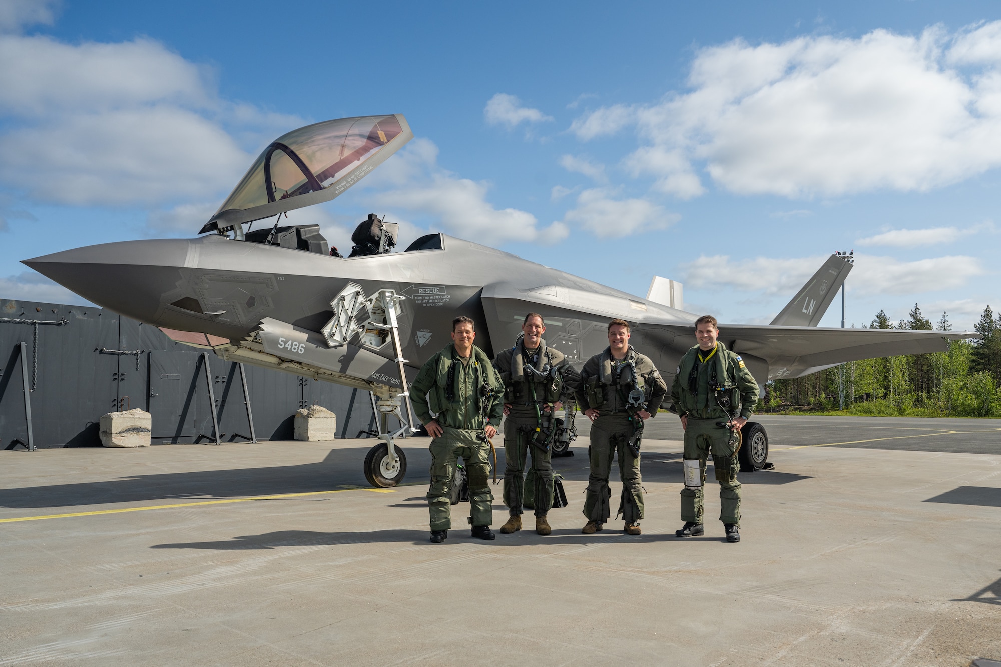 From left, Finnish Air Force Col. Saku Joukas, left, Lapland Air Wing commander, U.S. Air Force Brig. Gen. Jack Arthaud, 48th Fighter Wing commander, Capt. Hunter Robinson, 495th Fighter Squadron F-35A Lightning II pilot, and Finnish Air Force Lt. Col. Lasse Louhela, Fighter Squadron 11 commander, pose for a photo during exercise Atlantic Trident 25 at Rovaniemi Air Base, Finland, June 16, 2025. Atlantic Trident 25 allows the U.S., U.K., France and Finland to train in an interoperable environment, refining operational integration and ensuring Allied forces can seamlessly secure the Euro-Atlantic region. (U.S. Air Force photo by Senior Airman Christopher Campbell)