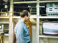 AT SEA – In 1990, Petty Officer First Class Bob Nees worked in a shop on the USS Carl Vinson (CVN 70), which was situated at the same level as the hangar deck. Nees and his team set up a color television on one of the shelves next to the spare equipment for occasional entertainment. (Bob Nees/Courtesy photo)