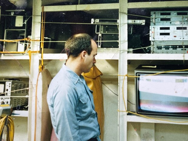 AT SEA – In 1990, Petty Officer First Class Bob Nees worked in a shop on the USS Carl Vinson (CVN 70), which was situated at the same level as the hangar deck. Nees and his team set up a color television on one of the shelves next to the spare equipment for occasional entertainment. (Bob Nees/Courtesy photo)