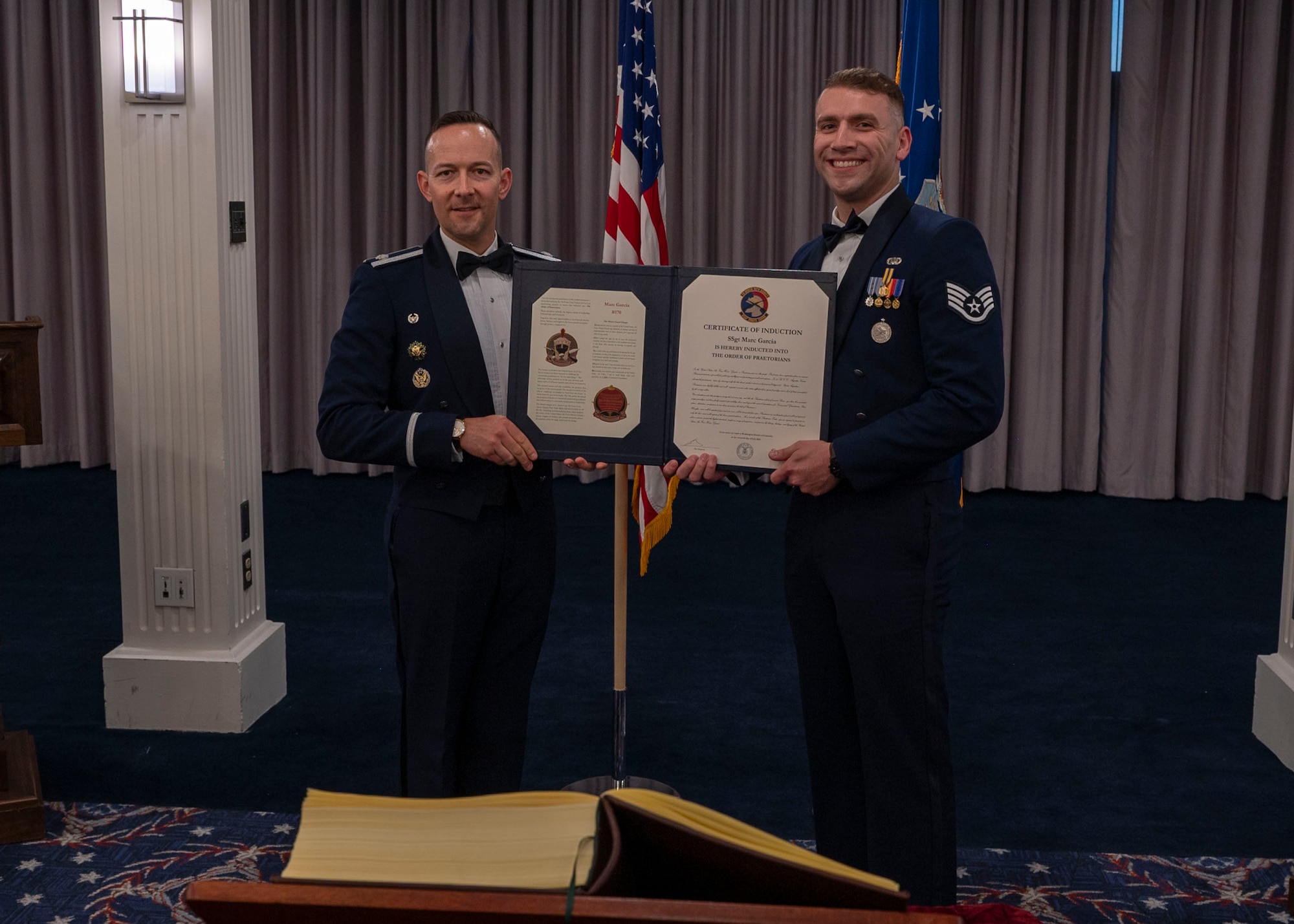 photo of two Air Force Honor Guard members holding a certificate.