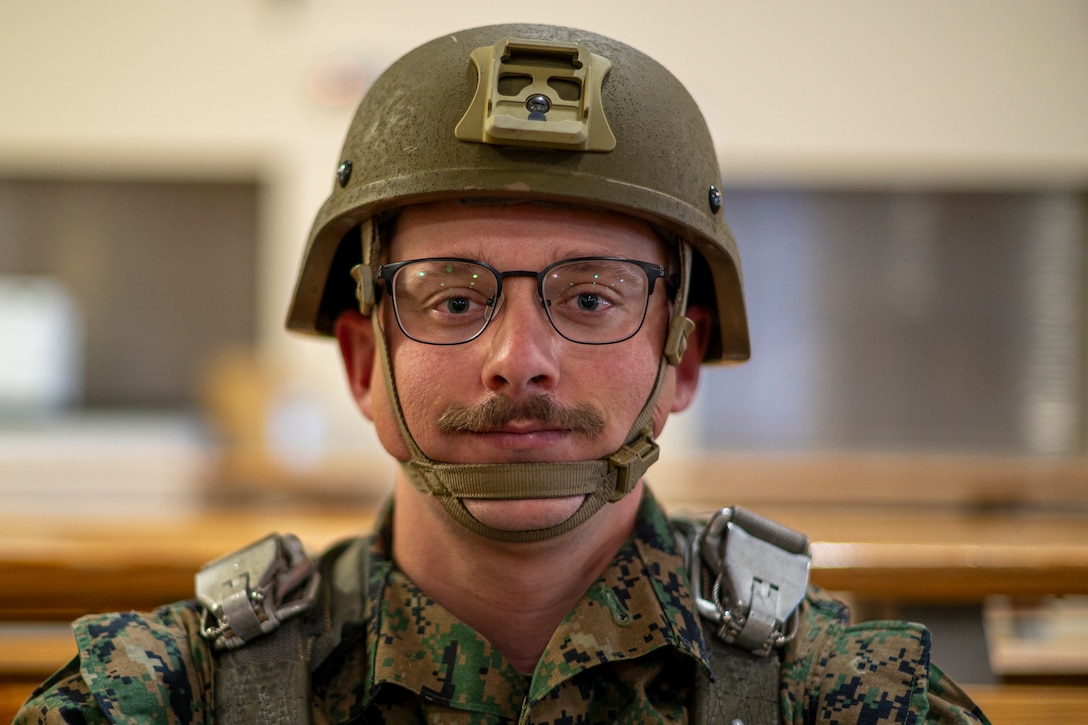 U.S. Marine Corps Cpl. Robert Furton, 4th Air Naval Gunfire Liaison Company joint fires observer, waits to board a C-130 Hercules for a static line jump during Red Flag-Alaska 25-2 at Joint Base Elmendorf-Richardson, Alaska, June 25, 2025. This exercise simulates the complexities of potential Indo-Pacific scenarios, providing unique opportunities to integrate various forces into joint, coalition and multilateral training from simulated forward operating bases, enhancing the U.S. and allies’ ability to respond effectively to contingencies in the region. (U.S. Air Force photo by Senior Airman Matthew Arachikavitz)