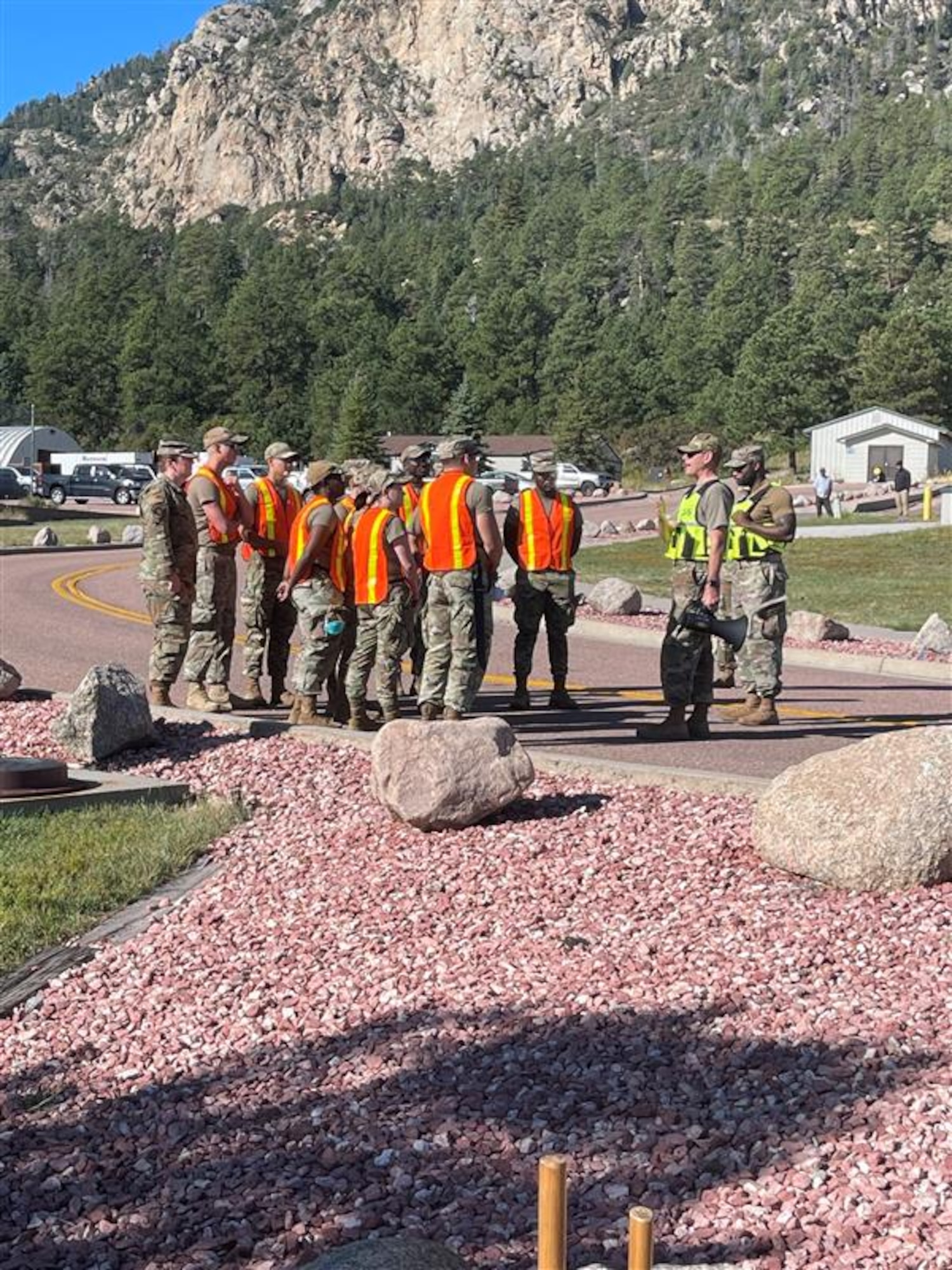 Members of the 21st Force Support Squadron Sustainment Services Flight huddle up to discuss participation in a search and recovery exercise at Cheyenne Mountain Space Force Station.