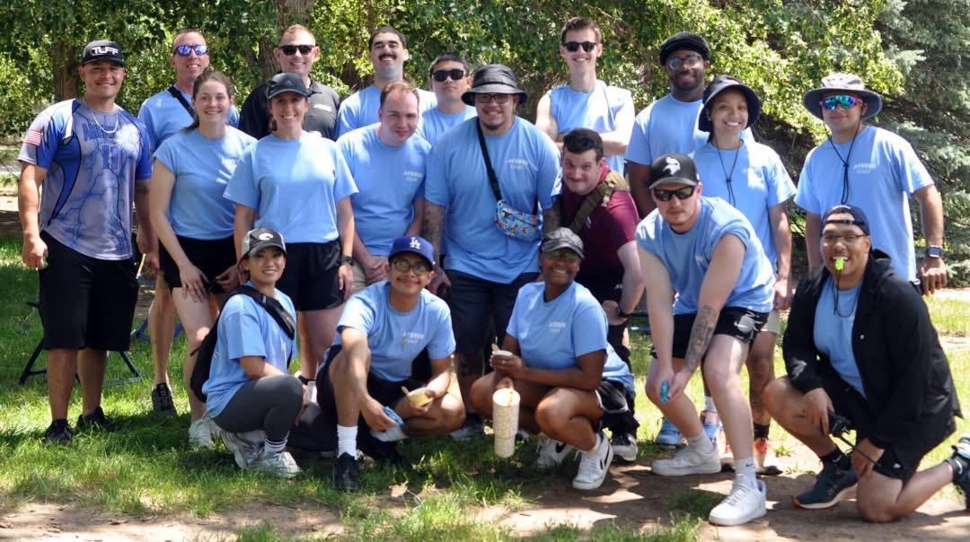 A group photo of participants posing in athletic clothes for the 2025 Space Base Delta 1 Sports and Readiness Day