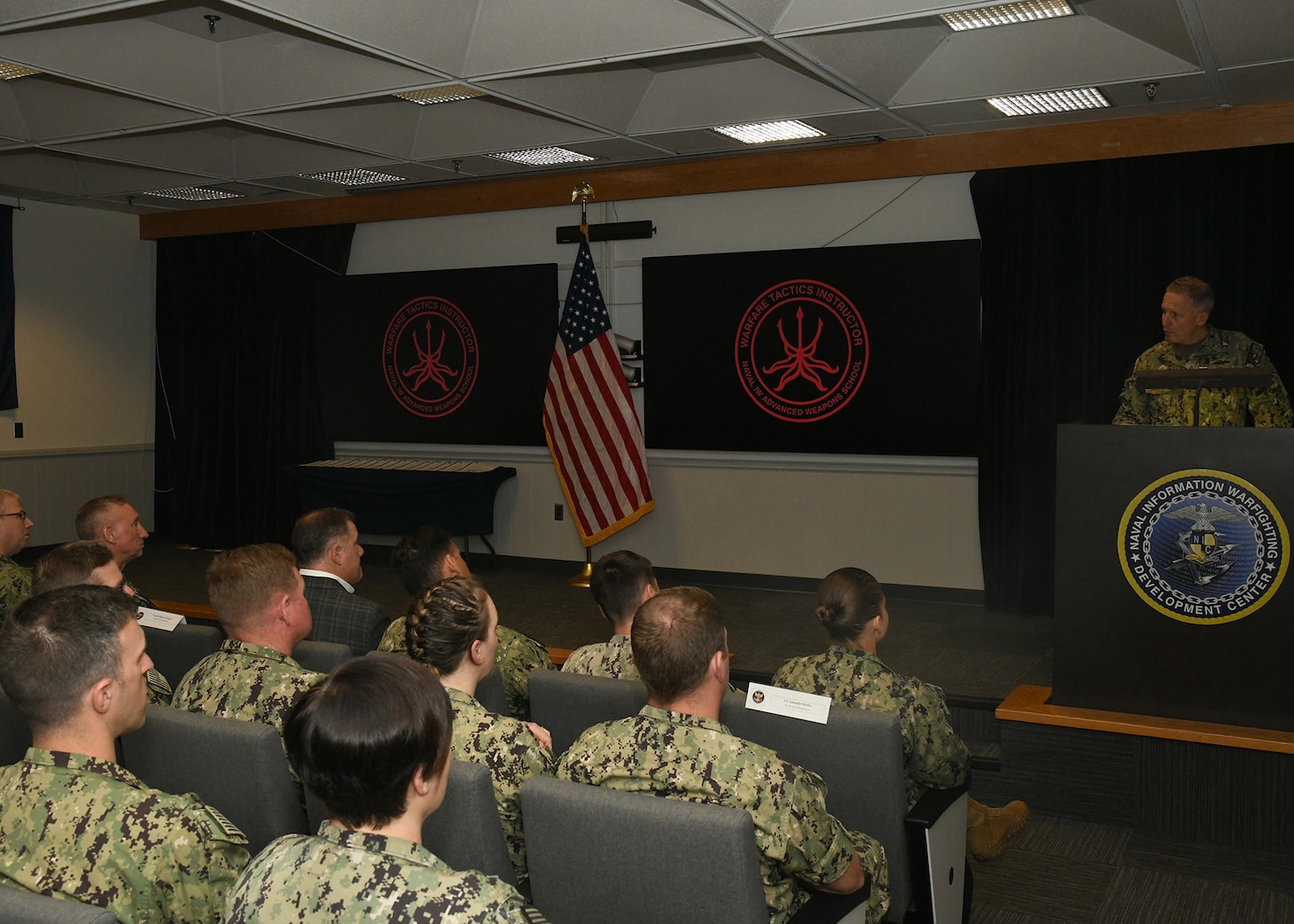Vice Adm. Mike Vernazza, Commander, Naval Information Forces, served as the guest speaker at the Naval Information Warfighting Development Center (NIWDC) graduation ceremony for 17 new Information Warfare (IW) Warfare Tactics Instructors (WTIs). The graduation marks a significant milestone, bringing the total number of IW WTIs in the cadre to 300. (U.S. Navy Photo by Robert Fluegel/RELEASED)