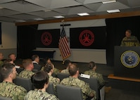 Vice Adm. Mike Vernazza, Commander, Naval Information Forces, served as the guest speaker at the Naval Information Warfighting Development Center (NIWDC) graduation ceremony for 17 new Information Warfare (IW) Warfare Tactics Instructors (WTIs). The graduation marks a significant milestone, bringing the total number of IW WTIs in the cadre to 300. (U.S. Navy Photo by Robert Fluegel/RELEASED)