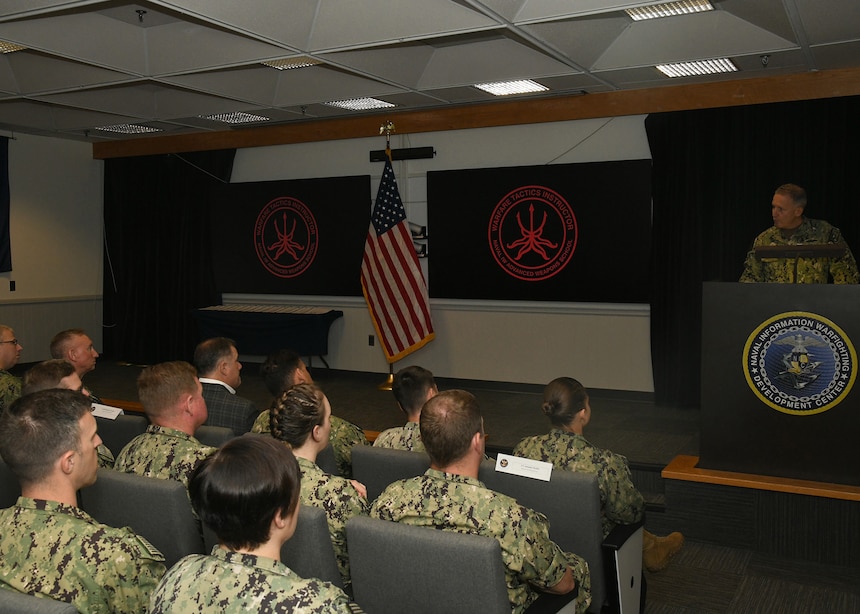 Vice Adm. Mike Vernazza, Commander, Naval Information Forces, served as the guest speaker at the Naval Information Warfighting Development Center (NIWDC) graduation ceremony for 17 new Information Warfare (IW) Warfare Tactics Instructors (WTIs). The graduation marks a significant milestone, bringing the total number of IW WTIs in the cadre to 300. (U.S. Navy Photo by Robert Fluegel/RELEASED)