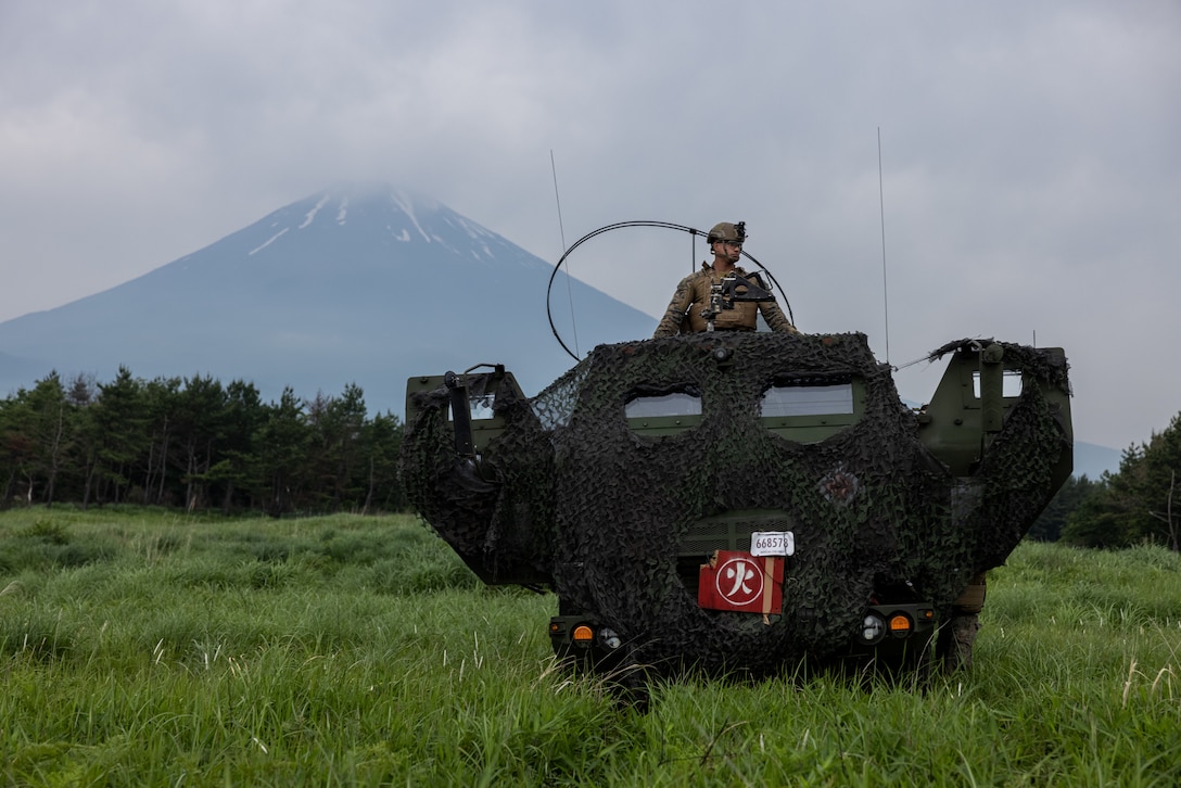 U.S. Marine Corps Sgt. Dawson Dauzat operates an M142 High Mobility Artillery Rocket System during a field training exercise at Combined Arms Training Center Camp Fuji, Japan, June 8, 2025. The training demonstrates 3d Battalion, 12th Marine Regiment’s ability to rapidly deploy long-range fire throughout the Indo-Pacific. Dauzat, a native of Texas, is a field artillery cannoneer with 3d Battalion, 12th Marine Regiment, 3d Marine Division. (U.S. Marine Corps photo by Lance Cpl. Rodney Frye)