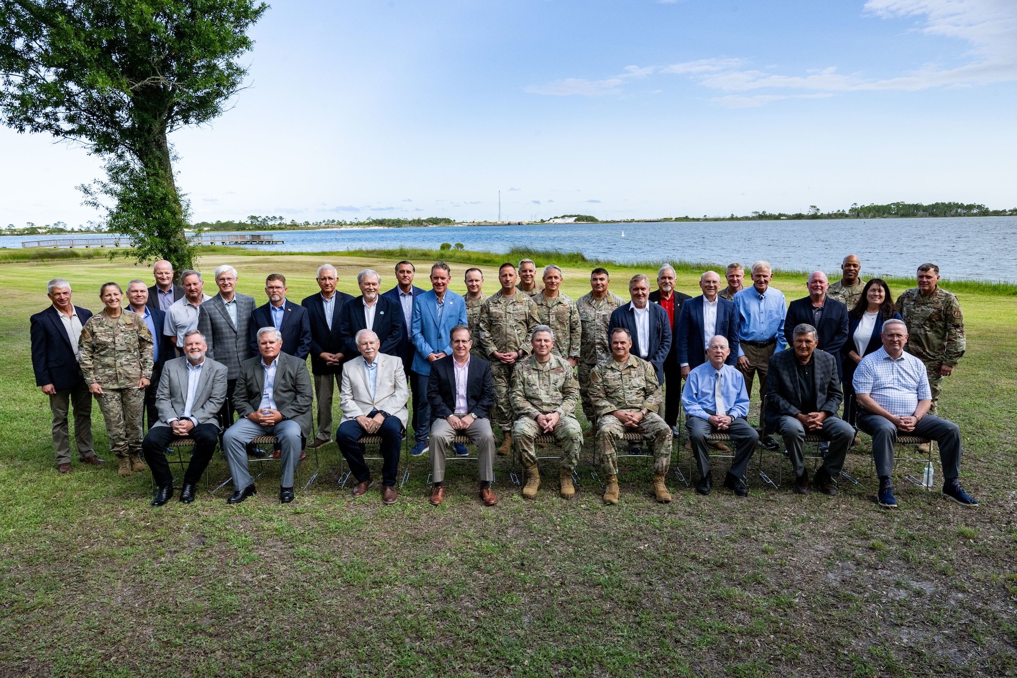 A group of current and former AFSOC senior leaders pose for a photo.