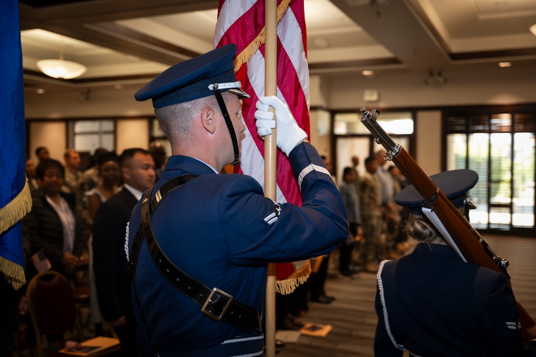 Airman holds American flag
