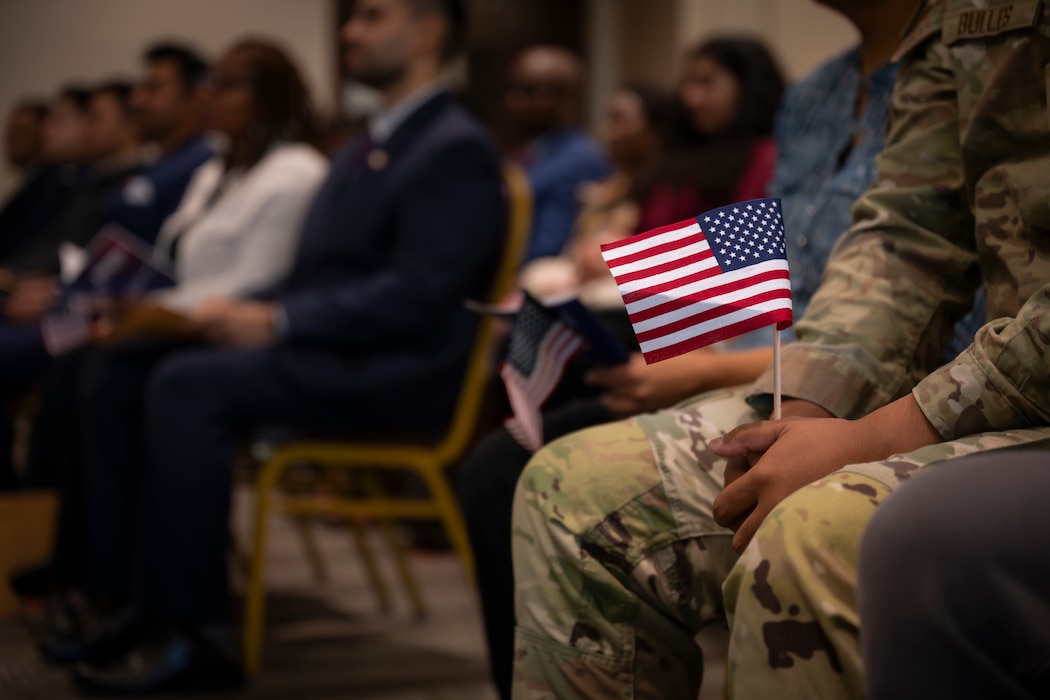 Airman holds American flag