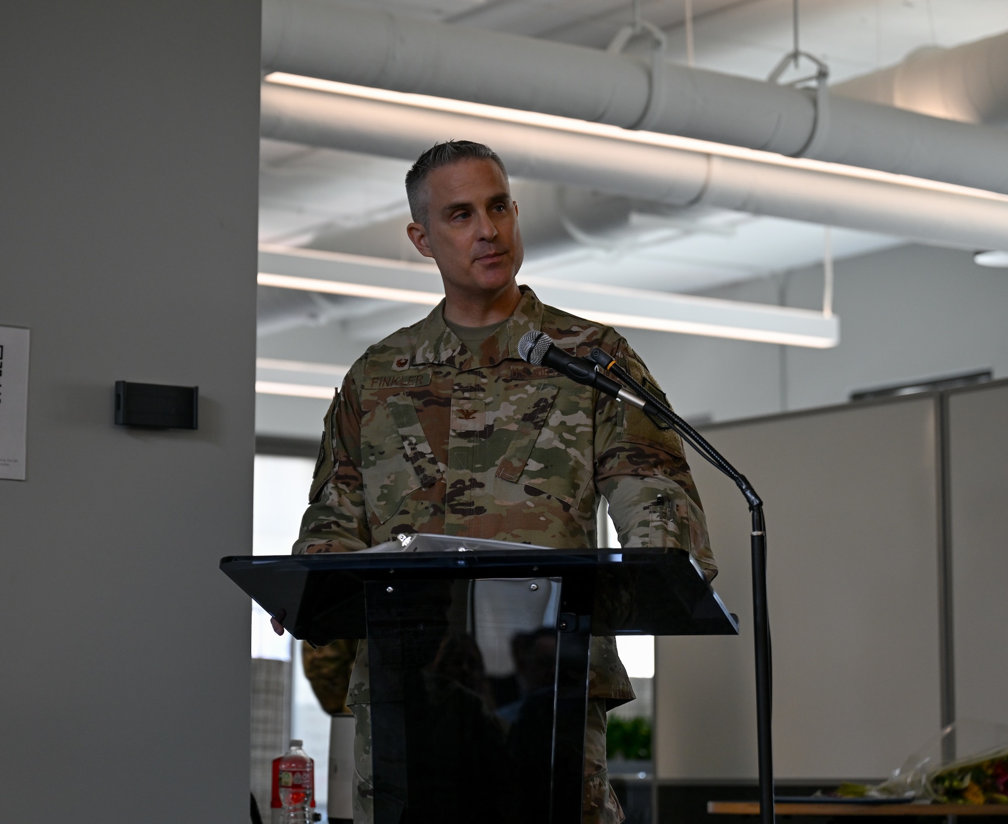 U.S. Air Force Col. Andrew Finkler, 850th Spectrum Warfare Group commander, gives opening remarks during the 563d Electronic Warfare Squadron change of command ceremony in San Antonio, Texas, June 27, 2025. The 563 EWS serves as a software development training arm, enabling others with best practices and techniques to secure electromagnetic spectrum superiority (U.S. Air Force photo by Capt. Benjamin Aronson)