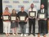 Photo of graduates posing with certificates